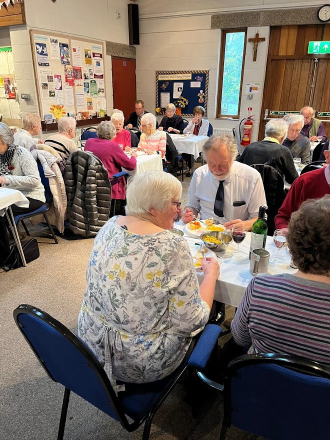 People eating lunch together as part of 'Fun, Food and Fellowship'